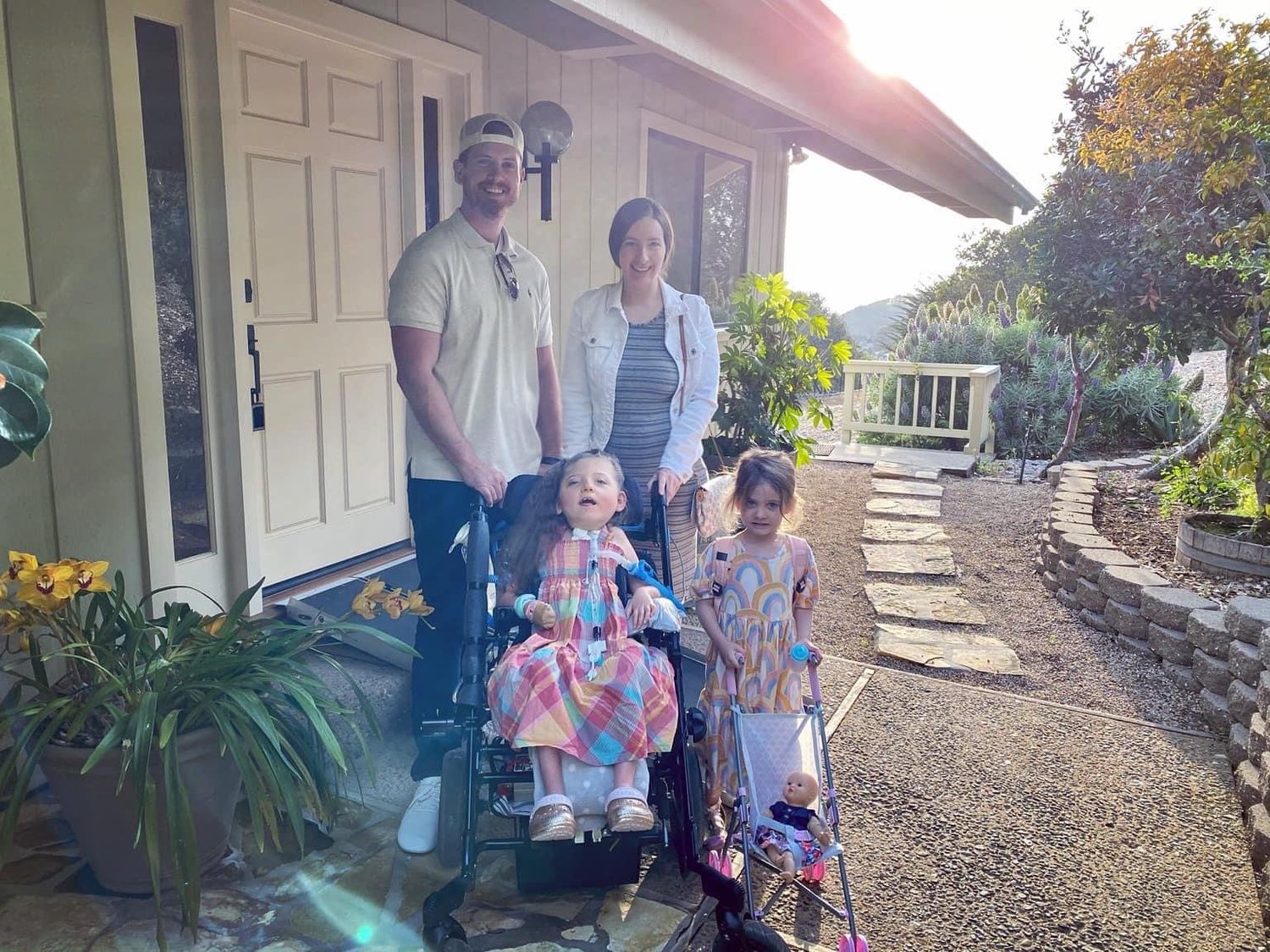 Lillian and her family outside their home